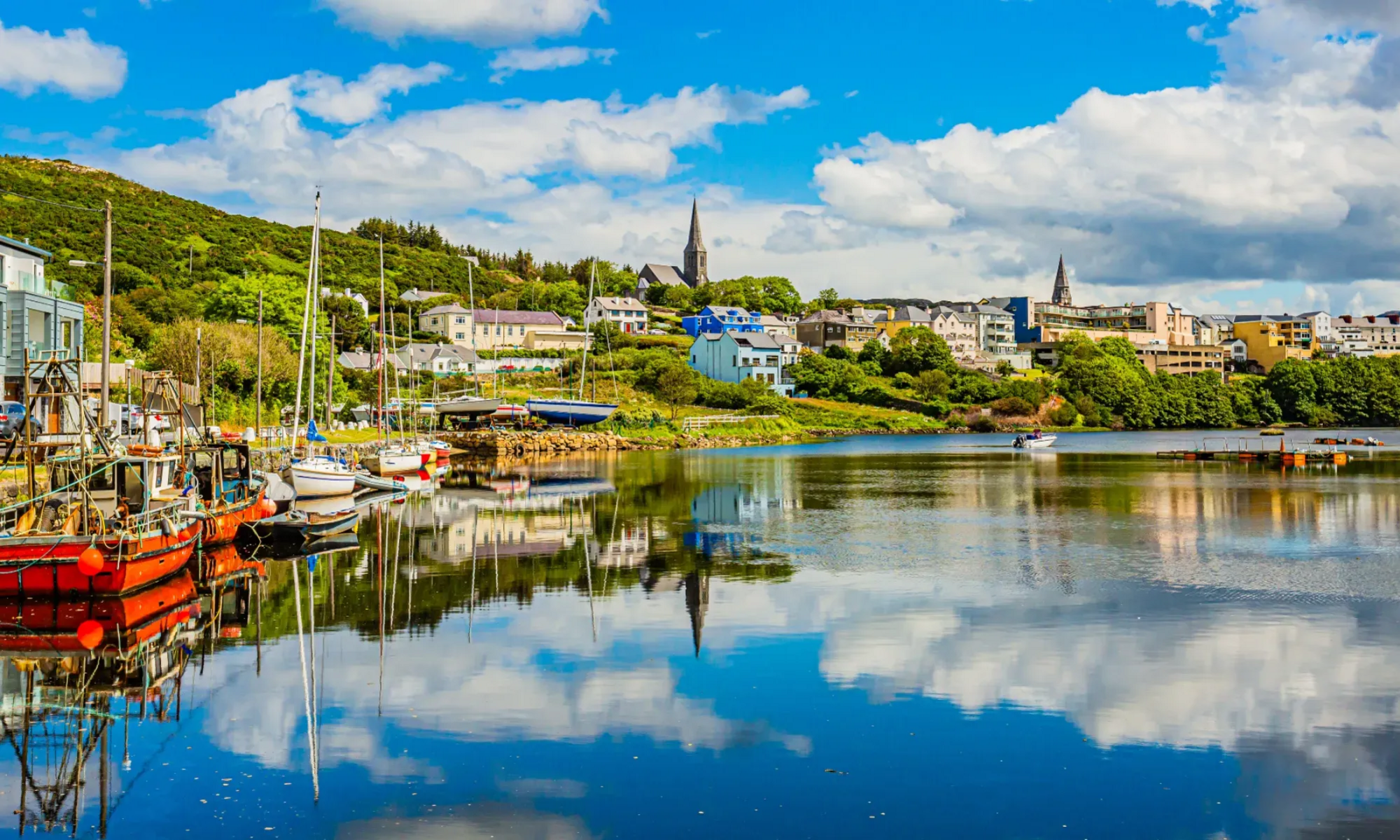 Boats moored by Irish season village